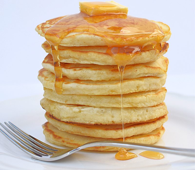 Gluten free pancake stack on a white plate