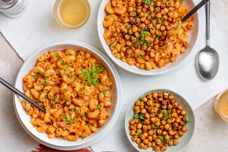 Bolognese with roasted chickpeas in white bowls